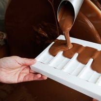 Tiroler Edle Purissima 60% – Edelbitterschokolade mit Mandelnougat & Himbeere 50g