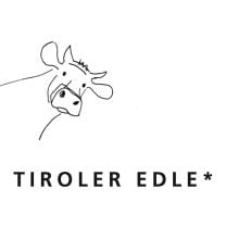 Tiroler Edle Purissima 60% – Edelbitterschokolade mit Mandelnougat & Himbeere 50g