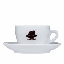 Kuntrawant Schmuggler-Cappuccino Tasse, markantes Schnäuzer-Emblem, als Symbol für die historische Kaffee-Schmuggeltradition in Südtirol. 