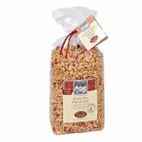 Honig-Pops von Fuchs Privatmühle, luftig-knuspriger Puffweizen mit Honig und getrockneten Erdbeerstücken.